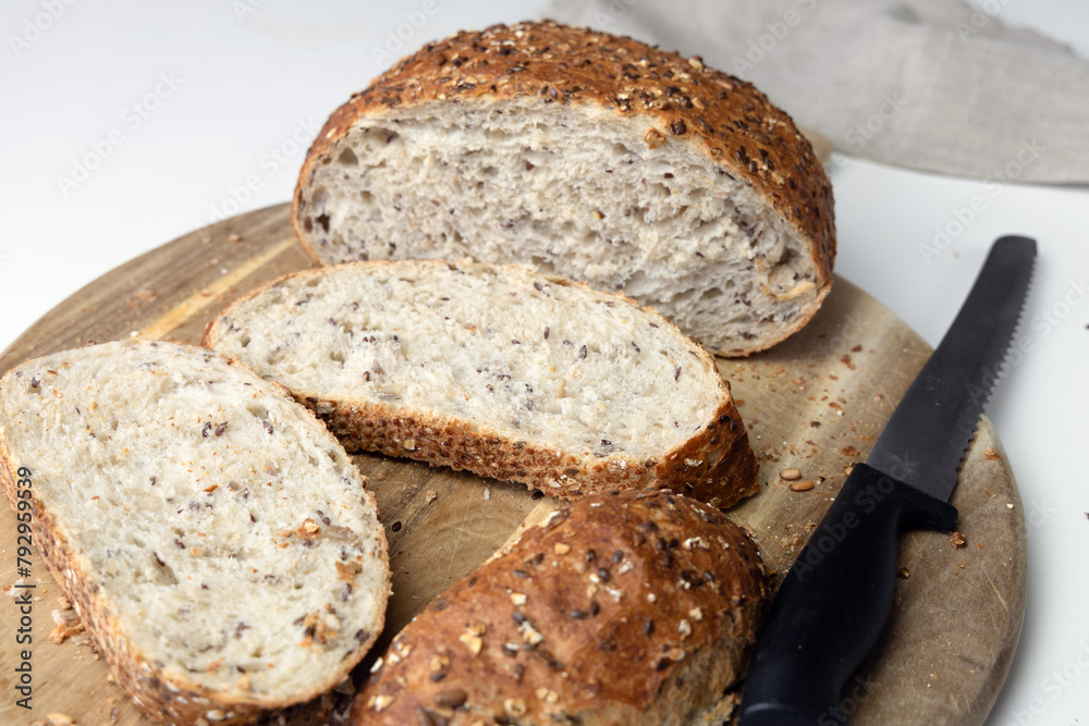 Fototapeta premium Freshly baked bread on a cutting board.