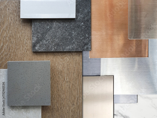 close up view of interior material samples including wood veneer, ceramic tiles, multi color of aluminium metallics, travertine granite tile, artificial stone, white marble. deluxe materials.