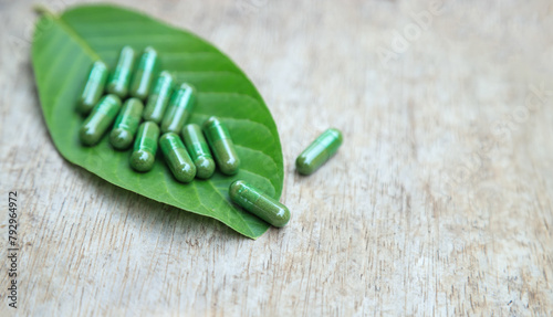 Green herbal capsules from herb for healthy eating in daily life