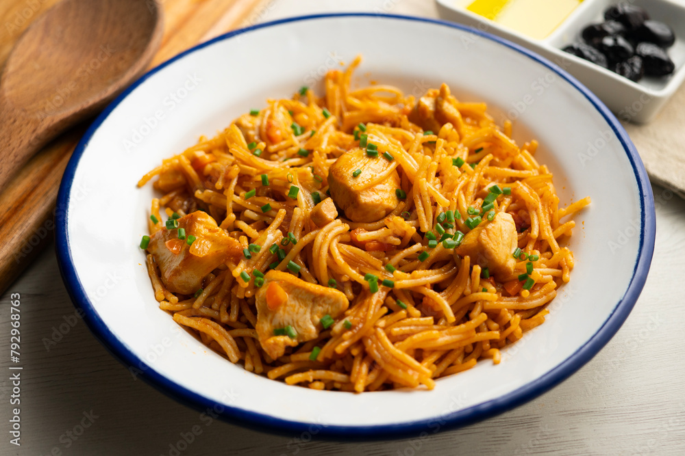 Spanish fideua paella with chicken and vegetables. Spanish fideua paella with chicken and vegetables.
