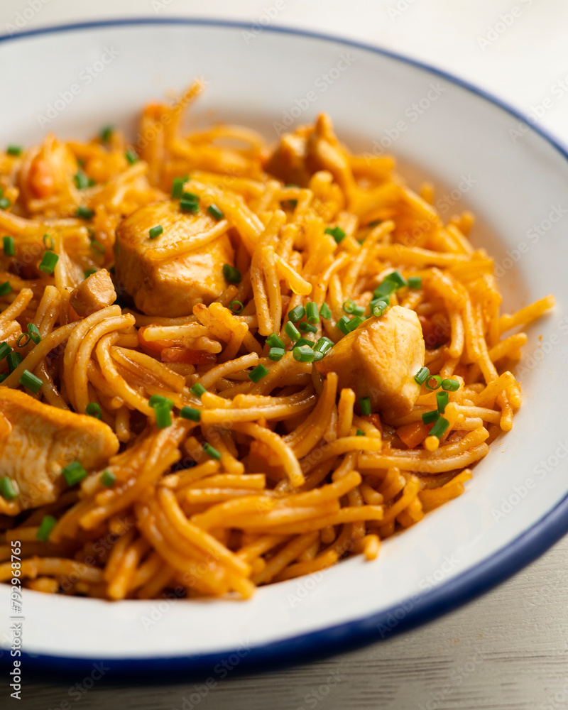 Spanish fideua paella with chicken and vegetables. Spanish fideua paella with chicken and vegetables.