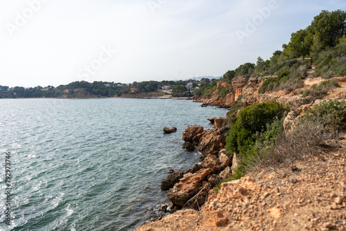 Hiking path with a view on a Mediterranean Sea and rocks on Costa Dorada coastline, Tarragona region