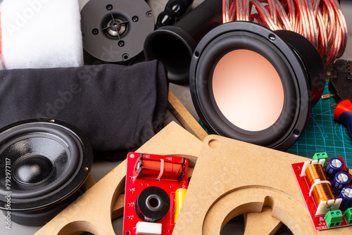 DIY audio speaker hifi components tools and materials on work bench in top view. audiophile sound and music concept background © stockphoto-graf