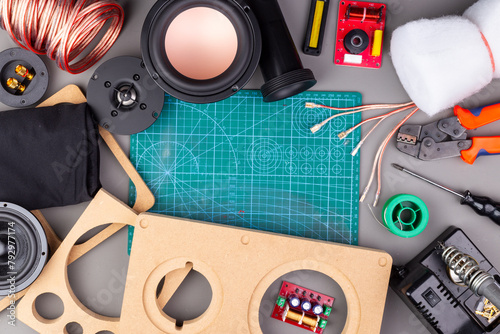 DIY audio speaker hifi components tools and materials on work bench in top view. audiophile sound and music concept background © stockphoto-graf