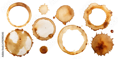 Brown coffee stains of various sizes are scattered across the transparent background, forming a random pattern of rings and splashes. The intensity of each stain varies.AI generated.