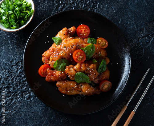 Pork in sweet and sour sauce and sesame seeds. A traditional Chinese dish.
