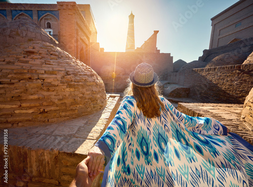Woman tourist at old city Khiva in Uzbekistan