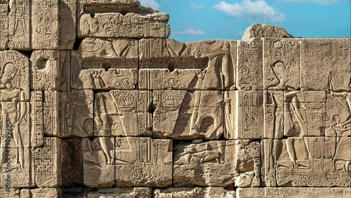 Ancient Egyptian murals and writings on the stone walls of the Karnak Temple in Luxor
