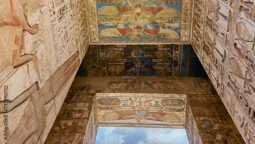Hieroglypic carvings and columns in ancient Egyptian Temple of Medinat Habu at Luxor photo