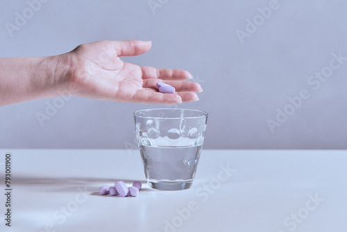 Dietary supplement in tablet and powder form taken with a glass of water