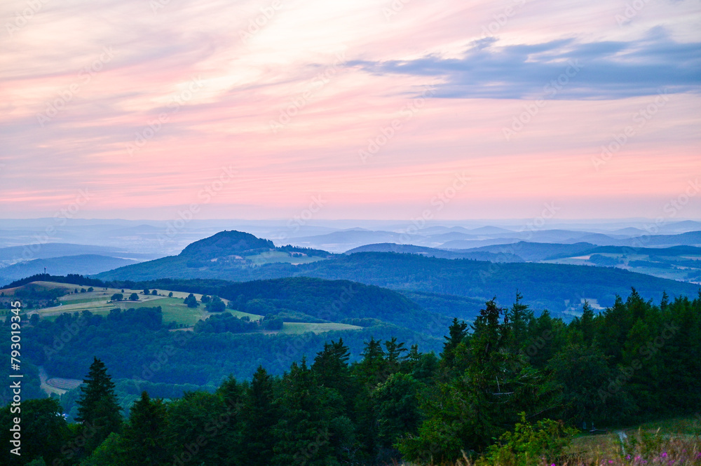 Wasserkuppe - panoramic view from the Radom observatory on the Wasserkuppe in the Hessian Rhön in summer towards Fulda in the sunset, Hessen, Germany
Wasserkuppe - panoramic view from the Radom observatory on the Wasserkuppe in the Hessian Rhön in summer towards Fulda in the sunset, Hessen, Germany