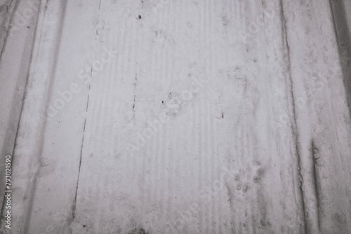 footprints and skis in the snow. background of a snow path. snowy ski path. background of a snowy path in the mountains