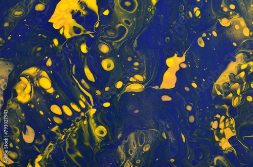 abstract art background in dark yellow and blue colors with cells and splashes