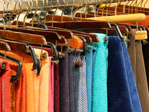 fine fabrics of many colors and fabrics for sale in the artisan tailoring shop photo