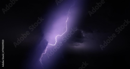 Lightning storm in the night sky. Multiple lightnings and thunders illuminate night sky