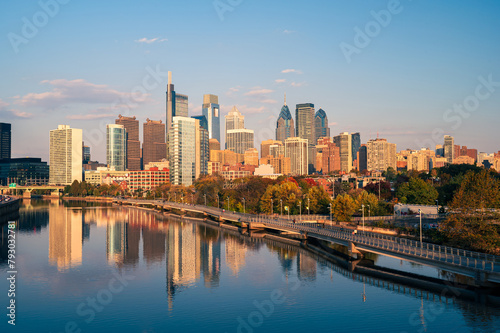 city skyline at sunset looks from over the river © Thu