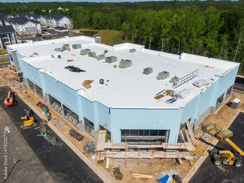 Obraz na płótnie Drone Images of TPO Flat Commercial Roof With Metal Panels: New & Existing Const