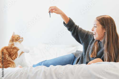 Bilde på lerret Love, playing and woman with cat in bedroom of home for bonding or having fun as pet owner