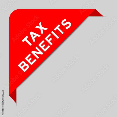 Red color of corner label banner with word tax benefits on gray background