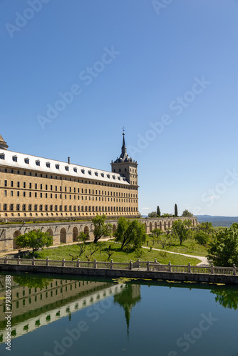 Real Monasterio de San Lorenzo de El Escorial historic building with gardens landscaped plants with artificial lake Madrid, Spain