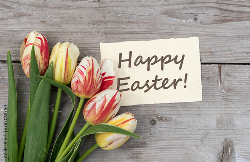 Greeting card with red, yellow and white tulips and English text: Happy Easter
