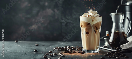 Ice coffee with cream in a tall glass and coffee beans, portafilter, tamper and milk jug photo