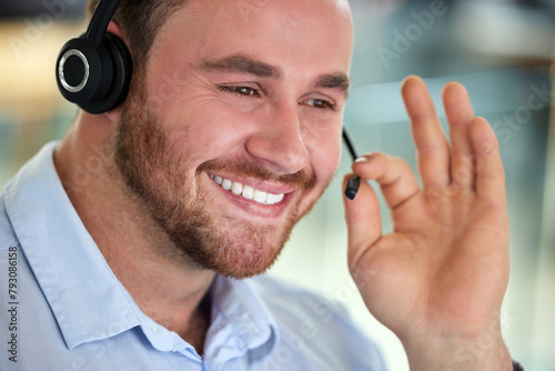 Smile, call center and man on mic for help, support or customer service in business office. Face, telemarketing and happy consultant on headset for advice, contact us and listen for crm sales online