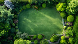 A tranquil green oasis beckons, as seen from above. Enclosed by an array of lush topiary and vibrant blooms, the well-kept grass forms a natural carpet that invites peaceful reflection and relaxation 