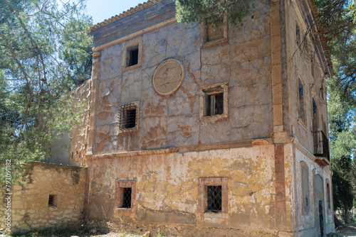 Beautiful abandoned country house in the forest, on a sunny morning