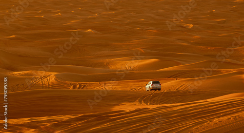 Dubai desert safari in sunset light. Off road safari in sand desert, Empty Quarter Desert in United Arab Emirates. Offroaders on dunes in Rub’ al Khali desert. photo