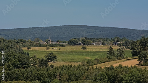 Hills of the Ardennes, with small Village of Cens with church, traditional houses and farms in Luxembourgh, Belgium 