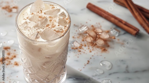 Delight in a refreshing glass of horchata served with ice and a sprinkle of cinnamon