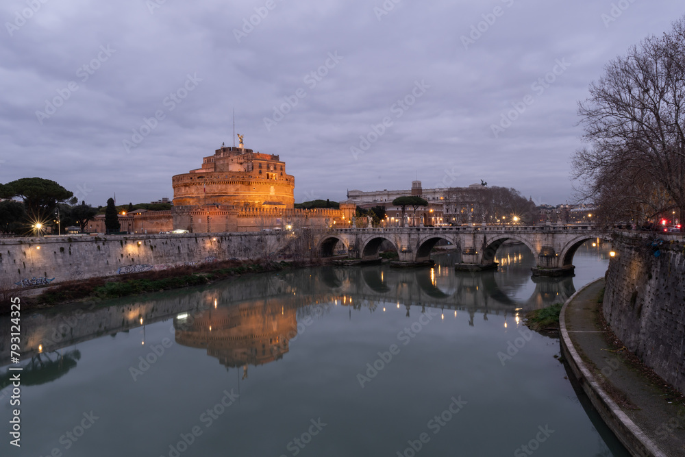 Castel Sant Angelo panorama at blue hour in Rome, italy. Reflection in the river.
