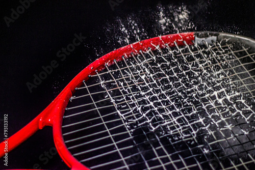 Bouncing white powder on a red racket © Vladimir Bartel