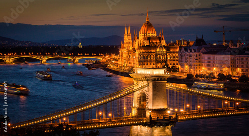 Spectacular view of the Danube river with the Chain bridge and Margit bridge fully lit up along with the historic Hungary Parliament building on the Danube in Budapest, Hungary
