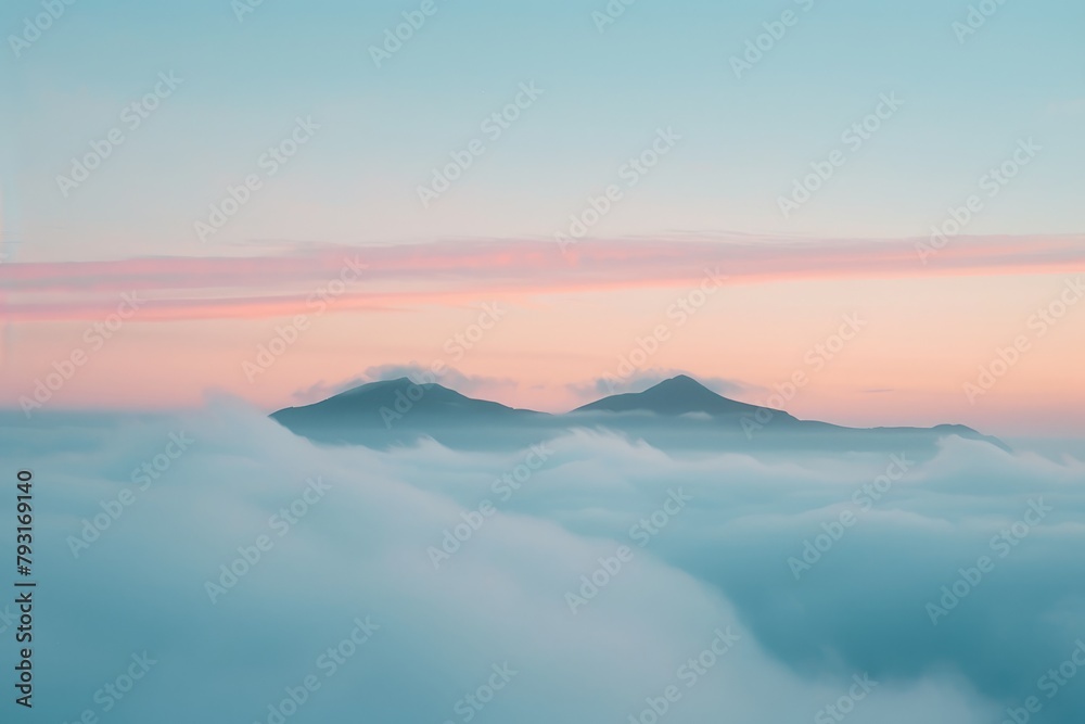   A pink-blue sky with clouds and distant mountains; mountains have pink-blue background