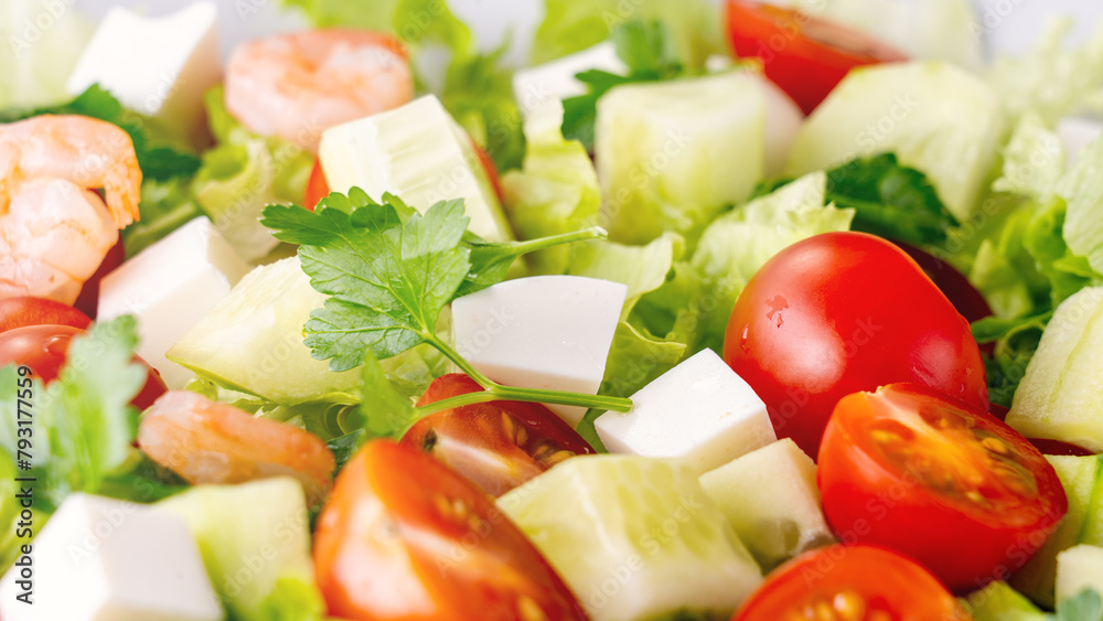 A close-up salad of fresh vegetables, a plate of fresh salad with vegetables and herbs. Greek salad with juicy tomatoes, feta cheese lettuce leaves green olives cucumber, fresh parsley. Homemade food. A close-up salad of fresh vegetables, a plate of fresh salad with vegetables and herbs. Greek salad with juicy tomatoes, feta cheese lettuce leaves green olives cucumber, fresh parsley. Homemade food.