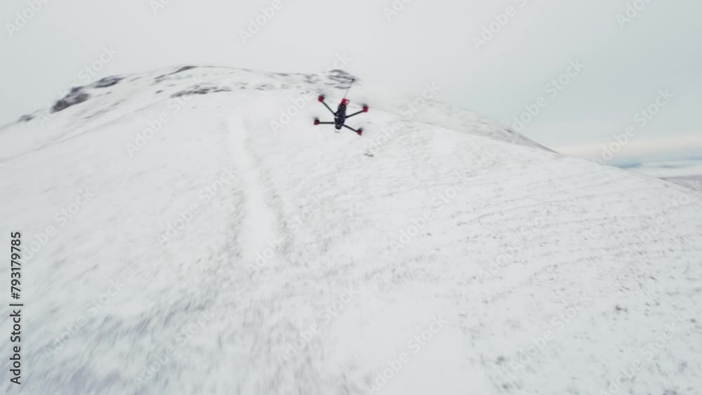 Rural landscape of fields and meadows covered with snow in winter, view from an FPV drone. Drone racing, fun modern competition Rural landscape of fields and meadows covered with snow in winter, view from an FPV drone. Drone racing, fun modern competition