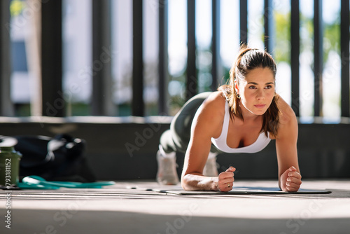 Determined Woman Exercising at Home photo