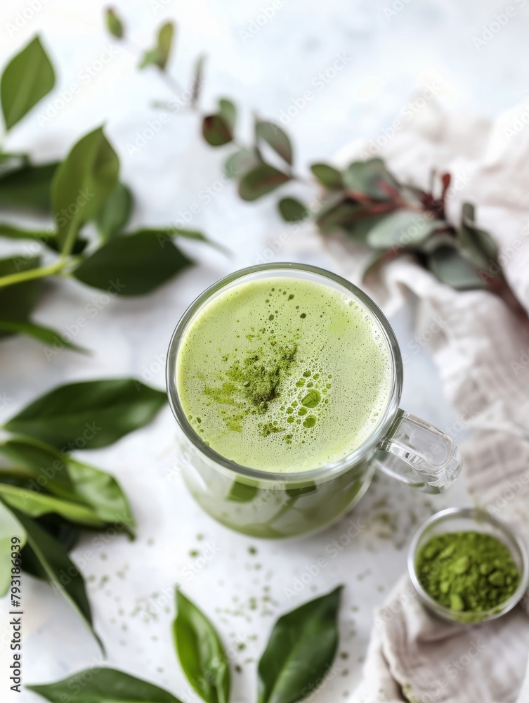 prepared matcha tea in a glass mug on a white background.