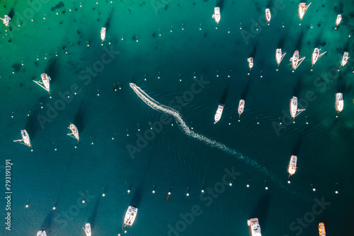 Aerial Image of Boat Riding Through Marina