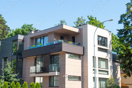 Modern residential apartment complex in summer, in a green area