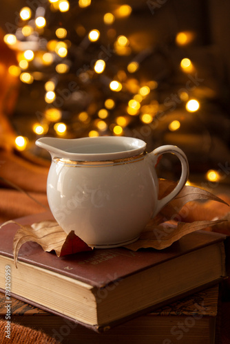 books  leaves  coffee cup and bokeh lights