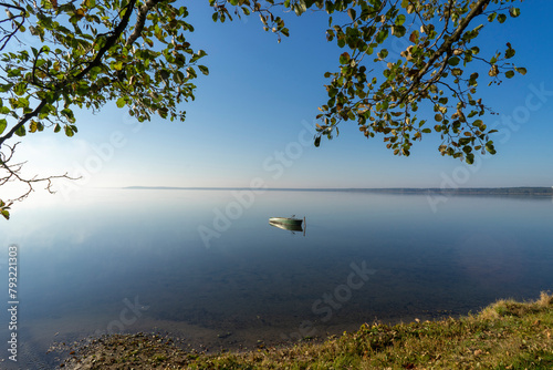 The picturesque shore of Lake Naroch on a foggy morning summer day, Belarus. photo