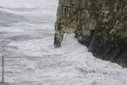 Waves crashing against the Bempton Cliffs in the East Riding of Yorkshire, UK