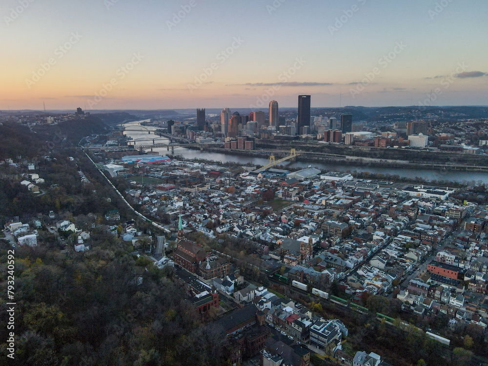 Fototapeta premium Aerial cityscape with river at sunset during fall and residential Pittsburgh Pennsylvania