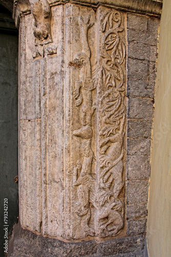 mostri e decorazioni vegetali; bassorilievo del portale posteriore della chiesa di San Fedele a Como photo