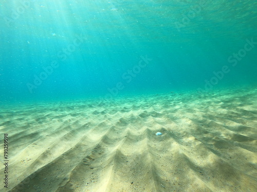 underwater blue ocean wbackground with sandy sea bottom in corfu island,Greece © ernestos