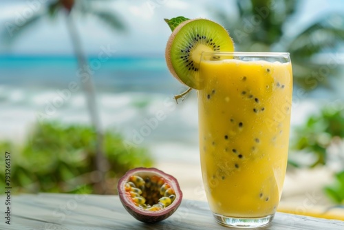 Glass of citrus juice with kiwi and passion fruit on a table