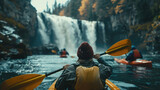 Adventurous kayakers paddling towards the base of a roaring waterfall, seeking an adrenaline-filled adventure
